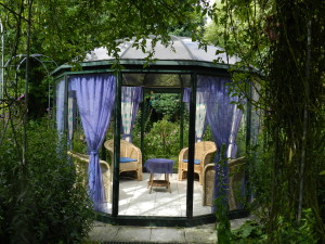 Gazebo with blue curtains and cushions at end of path; color;  PPA-Ada Hofman Garden (Aquatic Botanic Garden)-Enschede; 8/9/12