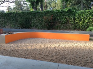 Curved and painted concrete wall outside kitchen and living room; gravel floor;  Jinko (Los Angeles); 4/5/15