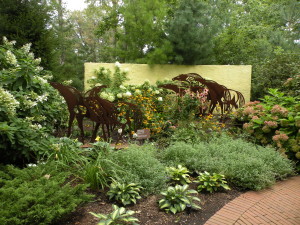 Dark bronze horse sculptures need pale yellow stucco wall as background; CBG;  8/24/10